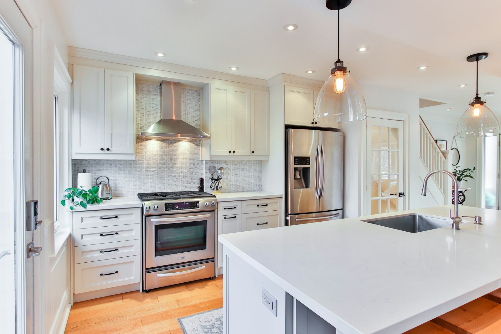 Bright kitchen with a professionally installed extractor hood